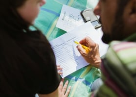 Photo of parent helping child with homework by Annika Gordon from Unsplash